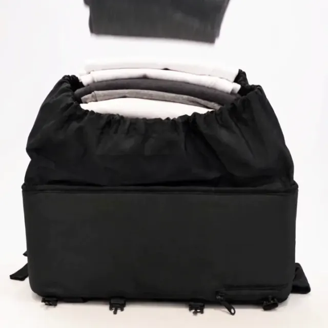 Ryanwear compression backpack — 15.7 × 11.8 × 7.9 in, sized inside Allegiant Air's free 18 × 14 × 8 in personal item allowance