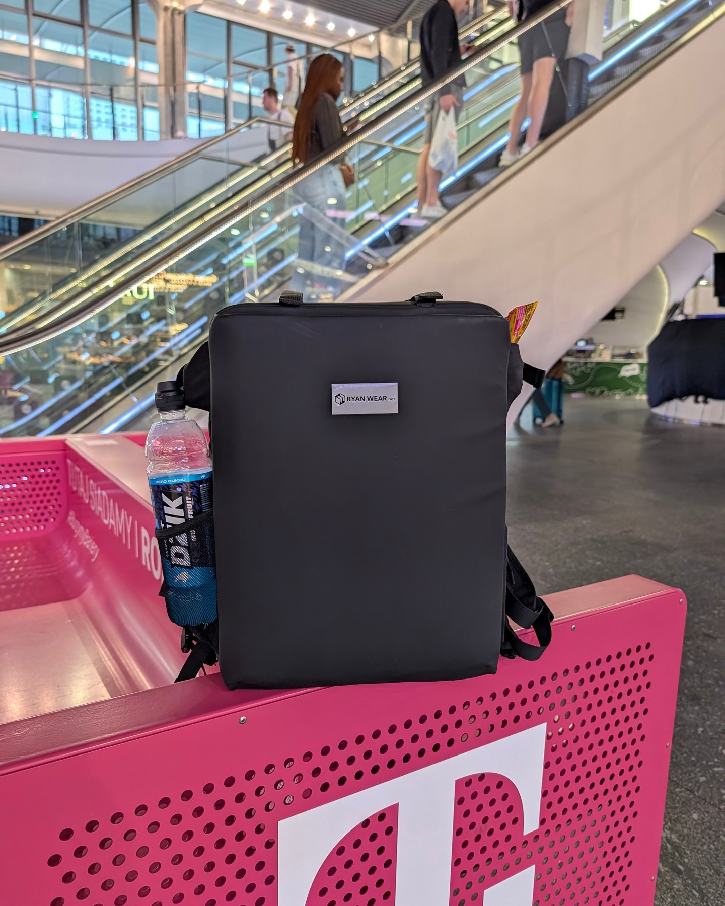 Spotted in the wild: one very unbothered backpack living its best gate-side life 🖤

Escalators buzzing, travelers rushi