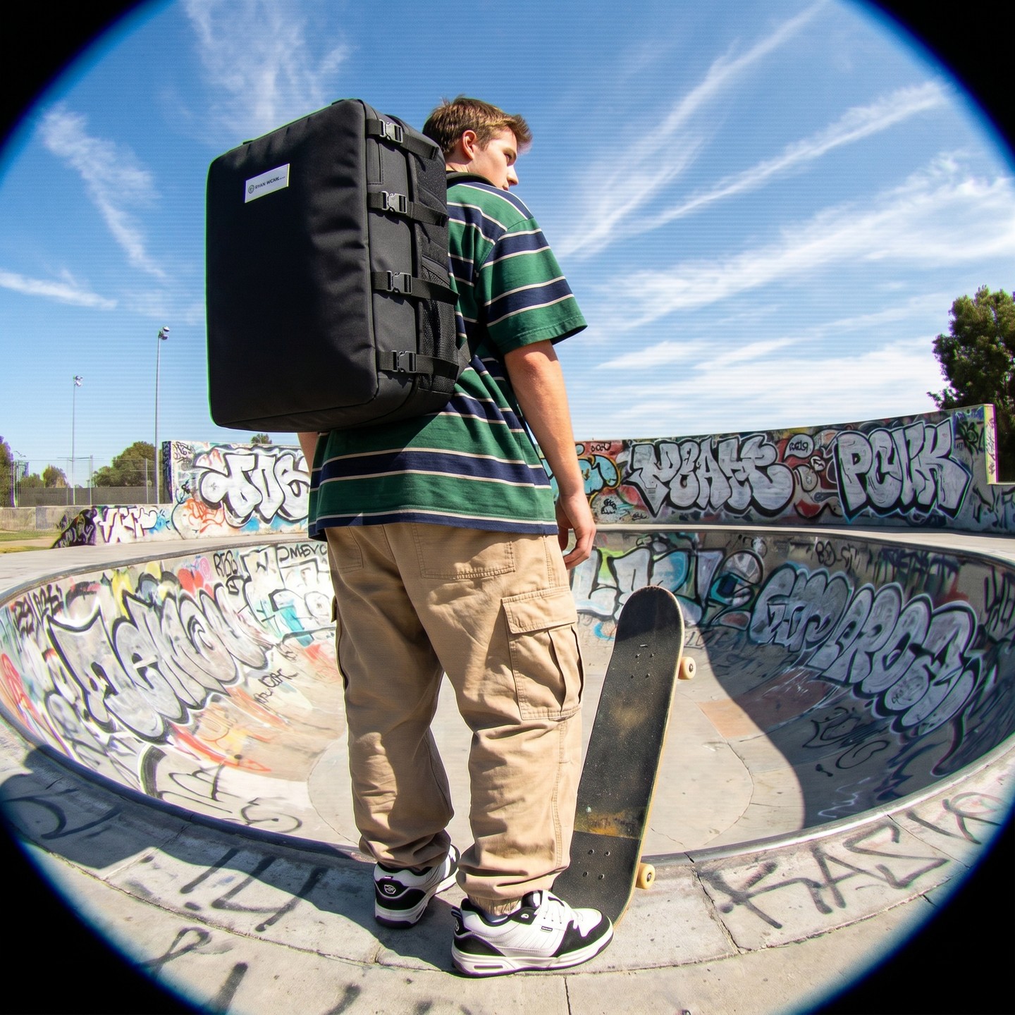 Airport? Never heard of her. 🛹 Board down, bag up, whole trip riding shotgun on his back. Graffiti bowl, blue skies, ze